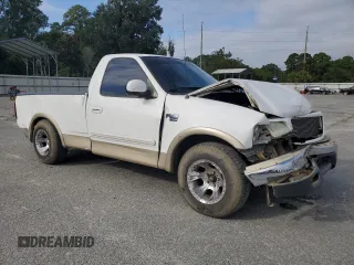 1999 Ford F-150 XL with VIN 1FTRF17L8XNA75702, listed as a Copart auction lot 69868104 with Not provided miles and Salvage title. Bid and sale history available at DreamBid. Image 4.