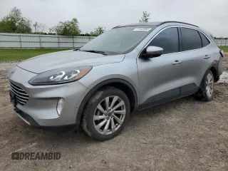 2021 Ford Escape Titanium z VIN 1FMCU9J99MUB12020, wystawiony jako Copart lot #51443365 z przebiegiem 63 504 mil mil oraz Szkoda całkowita • Salvage title. Historia ofert i sprzedaży dostępna na DreamBid. Obrazek 1.