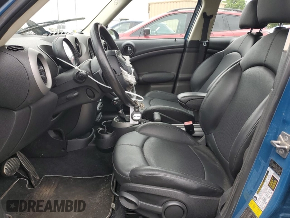 2012 MINI Countryman S with VIN WMWZC3C57CWL86423, listed as a Copart auction lot 57584195 with 102,184 mi miles and Salvage title. Bid and sale history available at DreamBid. Image 7.