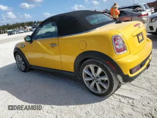 2015 MINI Roadster S z VIN WMWSY3C53FT595389, wystawiony jako Copart lot #77476814 z przebiegiem Nie podano mil oraz Szkody całkowita. Historia ofert i sprzedaży dostępna na DreamBid. Obrazek 2.