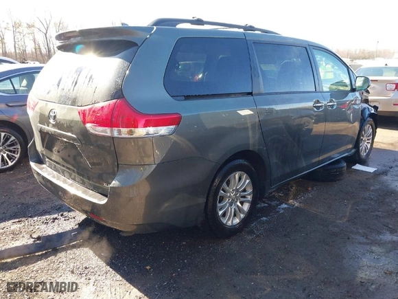2012 Toyota Sienna XLE AAS with VIN 5TDYK3DC8CS254057, listed as a IAAI auction lot 41853010 with 84,351 mi miles. Bid and sale history available at carsss.com. Image 4.