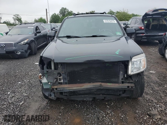 2011 Mercury Mariner Premier z VIN 4M2CN9HG1BKJ00209, wystawiony jako Copart lot #57016475 z przebiegiem 224 019 mil mil oraz Szkoda całkowita • Salvage title. Historia ofert i sprzedaży dostępna na DreamBid. Obrazek 5.