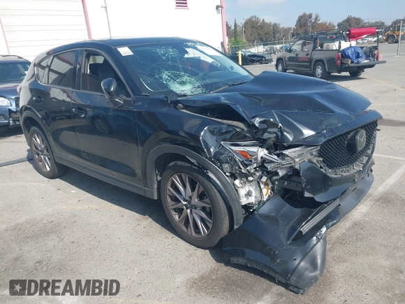 2019 Mazda CX-5 Grand Touring with VIN JM3KFADMXK1547727, listed as a IAAI auction lot 42138071 with Not provided miles and . Bid and sale history available at DreamBid. Image 1.