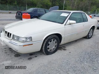 1997 Cadillac Eldorado Touring with VIN 1G6ET1293VU604921, listed as a IAAI auction lot 42113040 with 57,029 mi miles and . Bid and sale history available at DreamBid. Image 2.