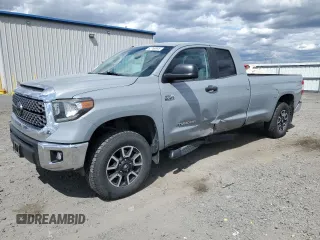 2018 Toyota Tundra with VIN 5TFCY5F12JX023940, listed as a Copart auction lot 62766545 with 74,746 mi miles and Salvage title. Bid and sale history available at DreamBid. Image 1.