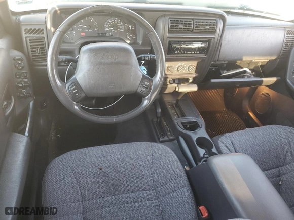 2000 Jeep Cherokee Police with VIN 1J4FF48S9YL101516, listed as a Copart auction lot 70304334 with NaN miles and Salvage Title. Bid and sale history available at carsss.com. Image 8.