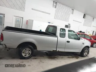 2002 Ford F-150 XL with VIN 1FTRX17W52NB23883, listed as a IAAI auction lot 41721680 with 144,115 mi miles. Bid and sale history available at carsss.com. Image 13.