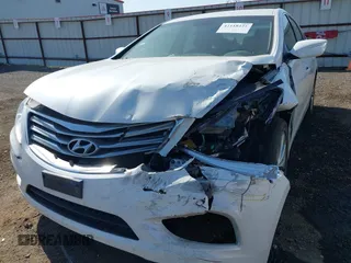 2014 Hyundai Azera with VIN KMHFG4JGXEA345249, listed as a IAAI auction lot 42118221 with 66,567 mi miles and . Bid and sale history available at carsss.com. Image 6.