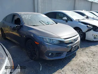 2018 Honda Civic EX-T z VIN 2HGFC1F38JH641159, wystawiony jako IAAI lot #42540837 z przebiegiem 125 168 mil mil oraz . Historia ofert i sprzedaży dostępna na DreamBid. Obrazek 1.