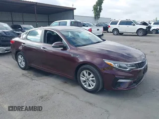2019 Kia Optima LX with VIN 5XXGT4L36KG284965, listed as a IAAI auction lot 40374239 with 64,351 mi miles. Bid and sale history available at carsss.com. Image 1.