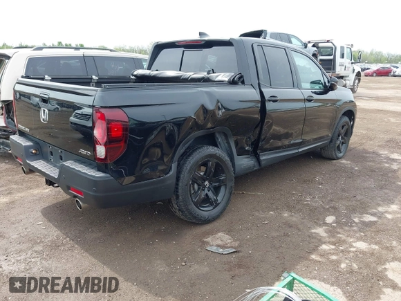 2023 Honda Ridgeline Black Edition with VIN 5FPYK3F83PB023481, listed as a IAAI auction lot 42157928 with 24,632 mi miles and . Bid and sale history available at DreamBid. Image 4.