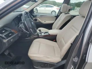 2012 BMW X5 35i with VIN 5UXZV4C59CL991689, listed as a Copart auction lot 64022615 with 208,620 mi miles and Salvage title. Bid and sale history available at DreamBid. Image 7.