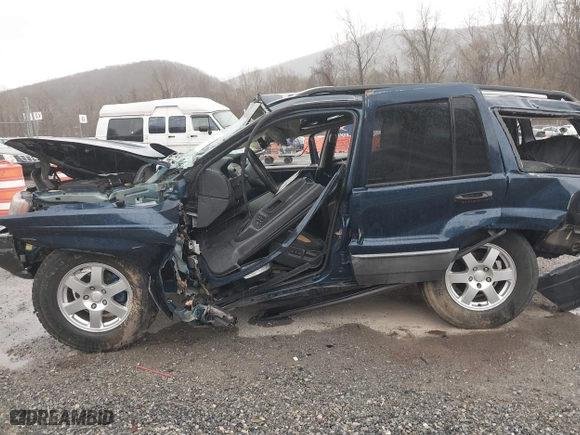 2002 Jeep Grand Cherokee Laredo with VIN 1J4GW48S82C321712, listed as a IAAI auction lot 41855809 with 1 mi miles. Bid and sale history available at carsss.com. Image 17.