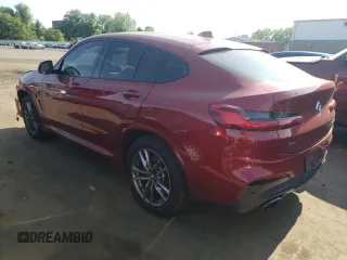 2021 BMW X4 M40i with VIN 5UX2V5C0XM9E78318, listed as a Copart auction lot 57834645 with 67,277 mi miles and Salvage title. Bid and sale history available at DreamBid. Image 2.