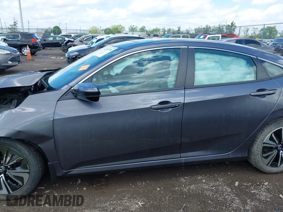 2018 Honda Civic EX-T z VIN 2HGFC1F34JH643975, wystawiony jako IAAI lot #42209799 z przebiegiem 58 684 mil mil oraz . Historia ofert i sprzedaży dostępna na DreamBid. Obrazek 14.