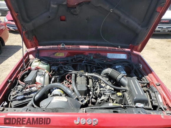 1992 Jeep Cherokee with VIN 1J4FJ58S0NL140995, listed as a Copart auction lot 56705875 with 253,657 mi miles and Salvage title. Bid and sale history available at DreamBid. Image 12.
