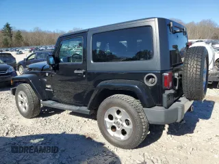 2014 Jeep Wrangler Sahara with VIN 1C4AJWBG2EL194843, listed as a Copart auction lot 79590514 with 80,574 mi miles and Non Repairable. Bid and sale history available at DreamBid. Image 2.