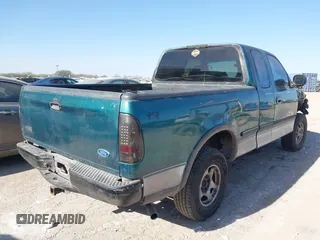 1997 Ford F-150 XL with VIN 1FTEX18L0VKC14651, listed as a IAAI auction lot 41228875 with 251,074 mi miles. Bid and sale history available at carsss.com. Image 4.