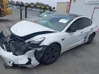 2023 Tesla Model 3 with VIN 5YJ3E1EA2PF417959, listed as a IAAI auction lot 42463853 with 22,736 mi miles and . Bid and sale history available at DreamBid. Image 2.