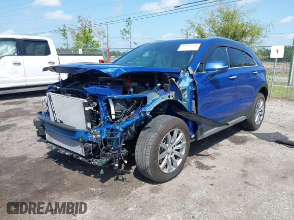 2023 Cadillac XT4 FWD Premium Luxury z VIN 1GYFZCR43PF104796, wystawiony jako IAAI lot #41931695 z przebiegiem 12 666 mil mil oraz . Historia ofert i sprzedaży dostępna na DreamBid. Obrazek 2.