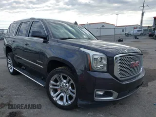 2017 GMC Yukon Denali with VIN 1GKS1CKJ0HR153941, listed as a IAAI auction lot 41300648 with 128,193 mi miles. Bid and sale history available at carsss.com. Image 1.