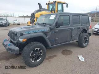 2024 Jeep Wrangler Rubicon z VIN 1C4RJXR67RW276710, wystawiony jako IAAI lot #42047318 z przebiegiem 35 857 mil mil oraz . Historia ofert i sprzedaży dostępna na DreamBid. Obrazek 19.