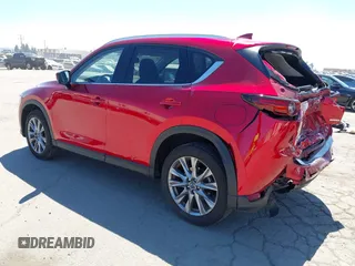 2021 Mazda CX-5 Grand Touring with VIN JM3KFADM5M0470483, listed as a IAAI auction lot 42785031 with 30,749 mi miles and . Bid and sale history available at DreamBid. Image 3.
