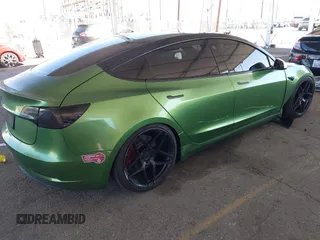 2020 Tesla Model 3 Standard Range Plus with VIN 5YJ3E1EA4LF799650, listed as a IAAI auction lot 41817538 with 54,835 mi miles. Bid and sale history available at carsss.com. Image 4.