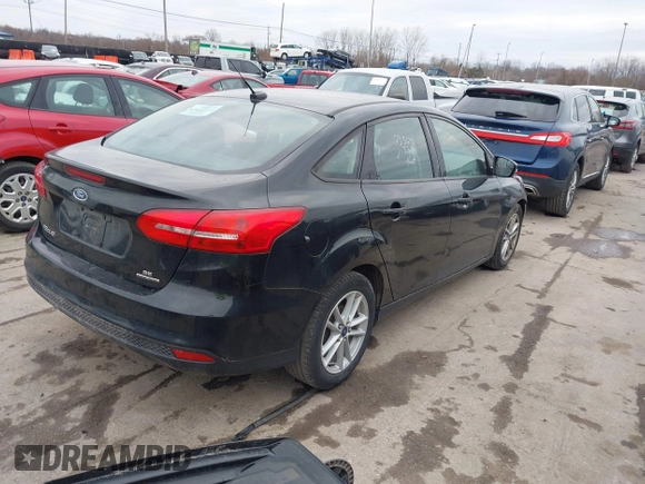 2015 Ford Focus SE with VIN 1FADP3F21FL355666, listed as a IAAI auction lot 41828579 with 110,002 mi miles. Bid and sale history available at carsss.com. Image 4.