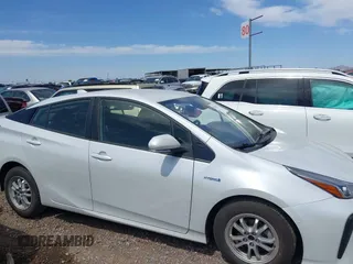 2022 Toyota Prius L Eco with VIN JTDKAMFUXN3181752, listed as a IAAI auction lot 42015717 with 129,637 mi miles and . Bid and sale history available at DreamBid. Image 13.