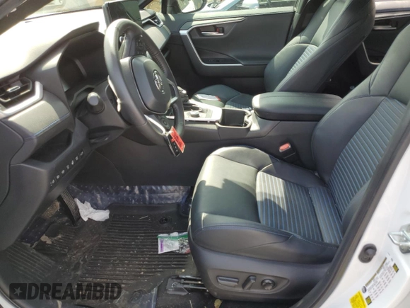 2023 Toyota RAV4 Hybrid XSE with VIN 2T3E6RFVXPW040152, listed as a Copart auction lot 61645565 with 26,408 mi miles and Salvage title. Bid and sale history available at DreamBid. Image 7.