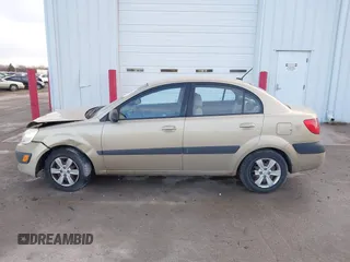 2009 Kia Rio SX with VIN KNADE223196512461, listed as a IAAI auction lot 41520063 with 132,558 mi miles. Bid and sale history available at carsss.com. Image 14.