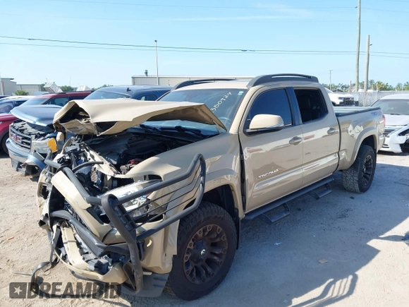 2018 Toyota Tacoma SR5 z VIN 3TMDZ5BN4JM039802, wystawiony jako IAAI lot #42300924 z przebiegiem 48 828 mil mil oraz . Historia ofert i sprzedaży dostępna na DreamBid. Obrazek 17.