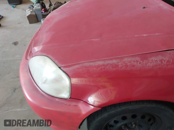 2000 Honda Civic DX z VIN 1HGEJ6227YL097214, wystawiony jako IAAI lot #41587618 z przebiegiem Nie podano mil oraz . Historia ofert i sprzedaży dostępna na DreamBid. Obrazek 10.