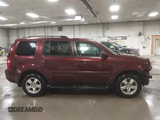 2011 Honda Pilot EX-L with VIN 5FNYF4H56BB051404, listed as a IAAI auction lot 41758332 with 301,099 mi miles. Bid and sale history available at carsss.com. Image 14.