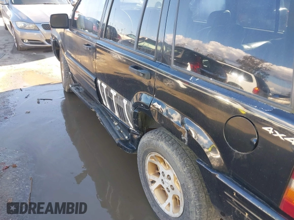 1998 Jeep Grand Cherokee Limited z VIN 1J4GZ78Y3WC105625, wystawiony jako IAAI lot #41742805 z przebiegiem 222 045 mil mil oraz . Historia ofert i sprzedaży dostępna na DreamBid. Obrazek 6.