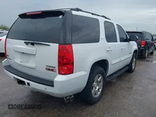 2009 GMC Yukon SLT w/4SA with VIN 1GKFK33049R153415, listed as a IAAI auction lot 41896770 with 182,256 mi miles. Bid and sale history available at carsss.com. Image 4.