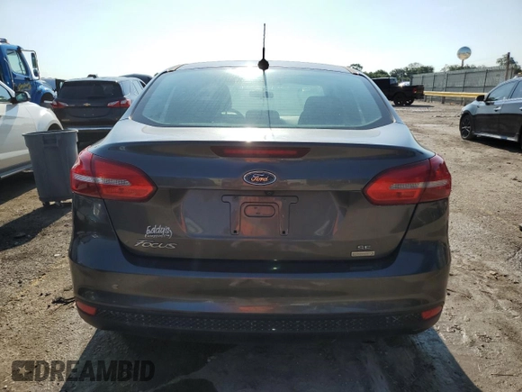 2016 Ford Focus SE with VIN 1FADP3FE1GL253425, listed as a Copart auction lot 64285965 with 105,309 mi miles and Salvage title. Bid and sale history available at DreamBid. Image 6.