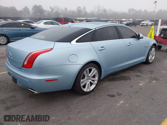 2013 Jaguar XJ with VIN SAJWA2G13DLV57881, listed as a IAAI auction lot 41478667 with 73,764 mi miles. Bid and sale history available at carsss.com. Image 4.