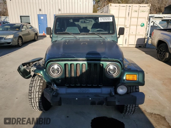 2000 Jeep Wrangler Sahara with VIN 1J4FA59S0YP795198, listed as a Copart auction lot 87920205 with 150,148 mi miles and Salvage Title. Bid and sale history available at carsss.com. Image 5.