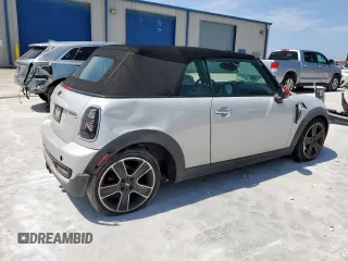 2013 MINI Convertible S с VIN WMWZP3C57DT705259, выставлен на аукционе Copart как лот 59954795 с пробегом 132 988 миль миль и Списание • Salvage title. История ставок и продаж доступна на DreamBid. Изображение 3.