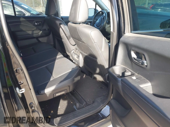 2020 Honda Ridgeline RTL with VIN 5FPYK3F59LB023212, listed as a IAAI auction lot 40704228 with 73,259 mi miles and . Bid and sale history available at DreamBid. Image 8.