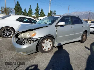 2003 Toyota Corolla CE with VIN 1NXBR32E13Z155142, listed as a Copart auction lot 79714184 with 299,999 mi miles and Salvage Title. Bid and sale history available at DreamBid. Image 1.