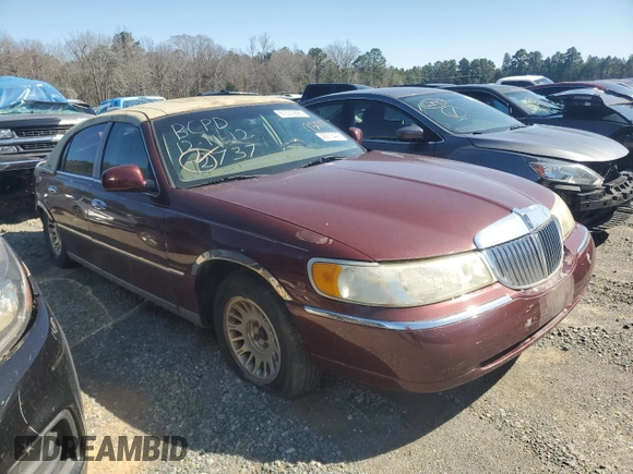 2001 Lincoln Town Car Cartier z VIN 1LNHM83WX1Y732737, wystawiony jako Copart lot #48216445 z przebiegiem 103 262 mil mil oraz Szkoda całkowita • Salvage title. Historia ofert i sprzedaży dostępna na DreamBid. Obrazek 4.