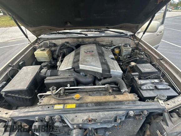 1998 Lexus LX 470 z VIN JT6HT00W7W0008417, wystawiony jako Copart lot #79324334 z przebiegiem 183 911 mil mil oraz Czysty tytuł • Clean title. Historia ofert i sprzedaży dostępna na DreamBid. Obrazek 7.
