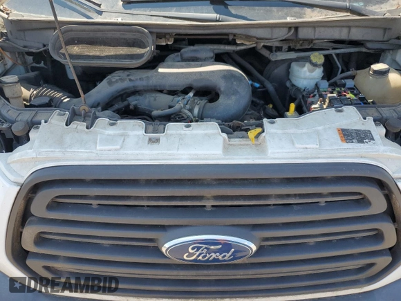 2016 Ford Transit Cargo z VIN 1FTYE1ZM0GKA05536, wystawiony jako Copart lot #65212565 z przebiegiem 146 219 mil mil oraz Czysty tytuł • Clean title. Historia ofert i sprzedaży dostępna na DreamBid. Obrazek 12.