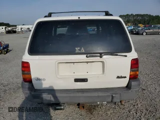 1996 Jeep Grand Cherokee Laredo z VIN 1J4EX58S3TC144191, wystawiony jako Copart lot #53153495 z przebiegiem 197 853 mil mil oraz Szkoda całkowita • Salvage title. Historia ofert i sprzedaży dostępna na DreamBid. Obrazek 6.
