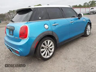 2017 MINI Hardtop 4 Door Cooper S z VIN WMWXU3C37H2F48944, wystawiony jako IAAI lot #41732140 z przebiegiem 154 563 mil mil oraz . Historia ofert i sprzedaży dostępna na DreamBid. Obrazek 4.