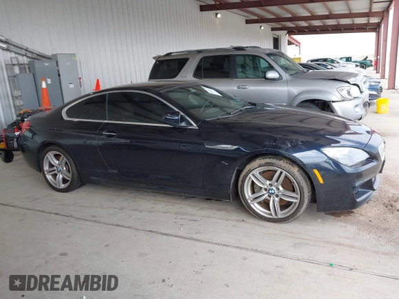 2012 BMW 6 Series 650i z VIN WBALX3C51CDV77602, wystawiony jako IAAI lot #41668235 z przebiegiem 103 684 mil mil oraz . Historia ofert i sprzedaży dostępna na DreamBid. Obrazek 13.
