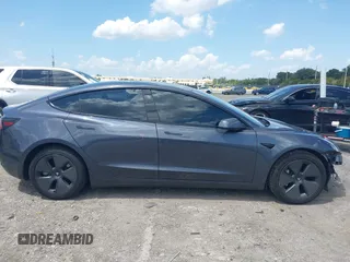 2023 Tesla Model 3 with VIN 5YJ3E1EAXPF575448, listed as a IAAI auction lot 42019288 with 33,859 mi miles and . Bid and sale history available at carsss.com. Image 14.